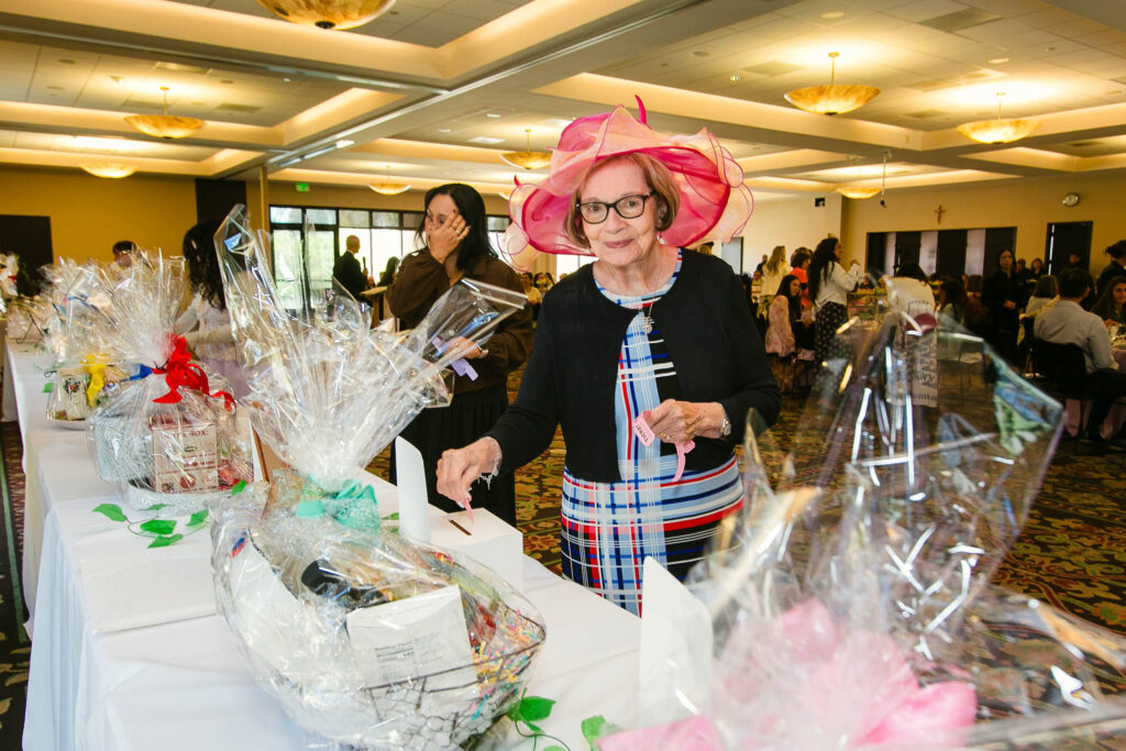Tea 2026 guests looking at auction items